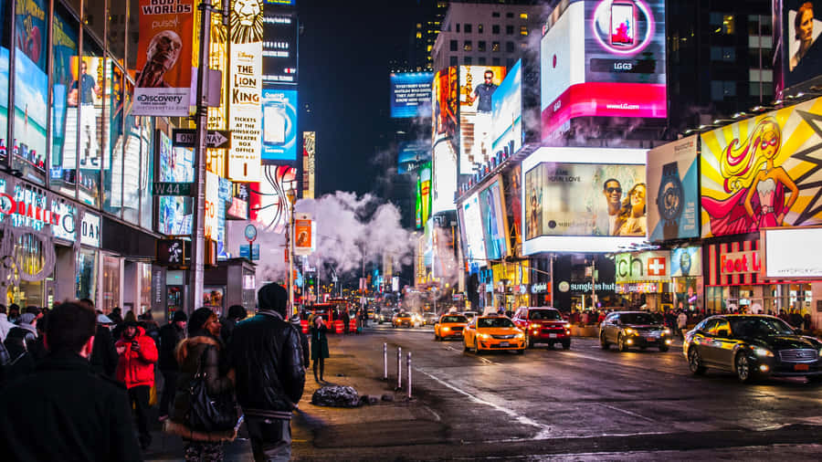 Night Lights Shine Brightly In Times Square. Wallpaper