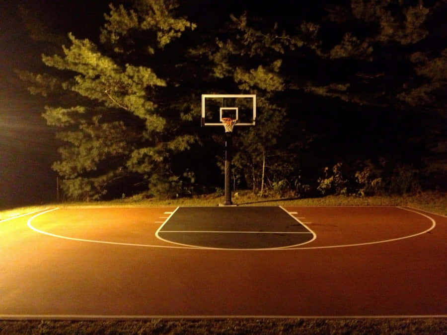 Nighttime Outdoor Basketball Court Wallpaper