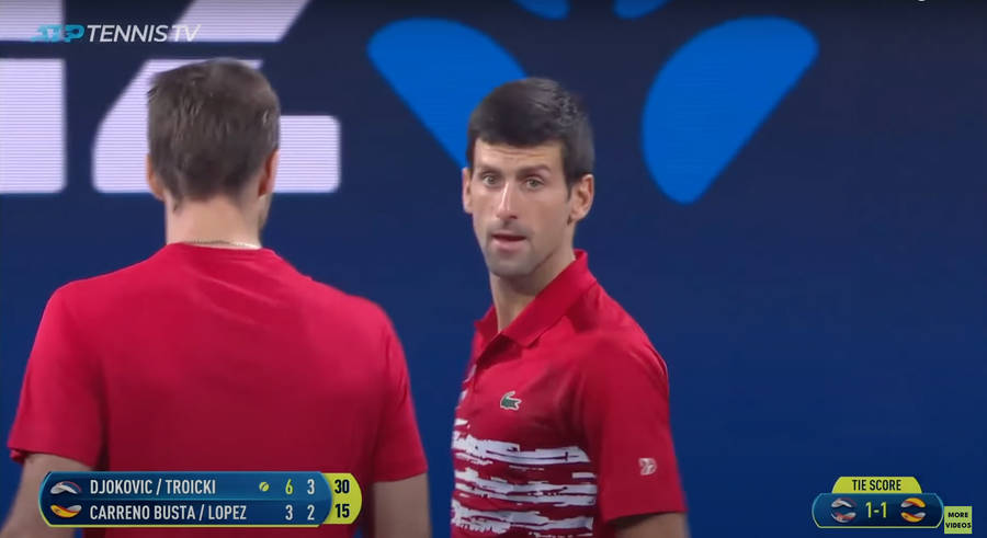 Novak Djokovic And Victor Troicki In Competitive Action Wallpaper