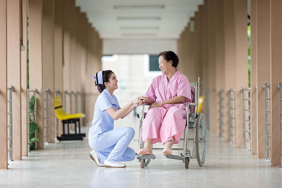 Nursing With Old Woman Patient Wallpaper