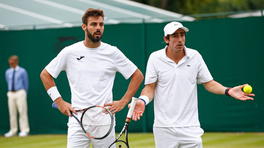 Pablo Cuevas Looking Confused With Marcel Granollers Wallpaper