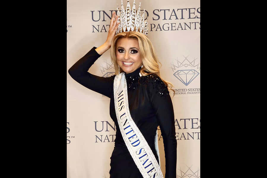 Pageant Winner With Crownand Sash Wallpaper