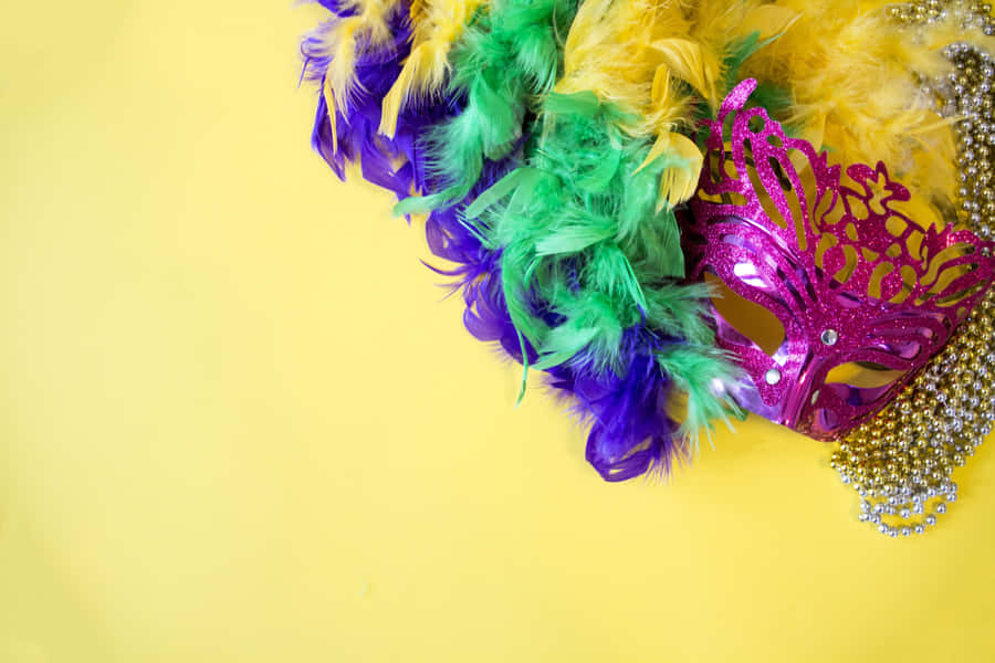Pastel Yellow Mardi Gras Mask Wallpaper