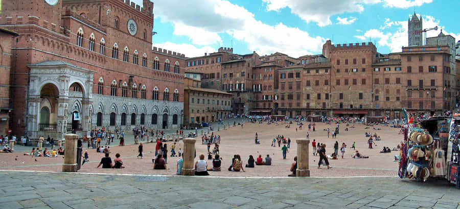 People At Piazza Del Campo In Siena Wallpaper