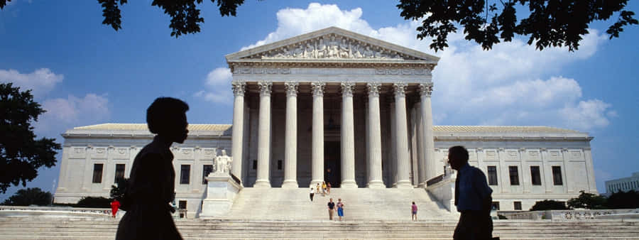 People Walking By The Supreme Court Building Wallpaper