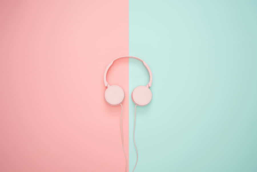 Pink Headphones On A Pink And Blue Background Wallpaper