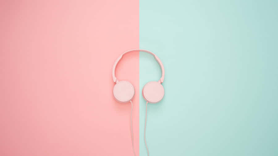 Pink Headphones On A Pink And Blue Background Wallpaper