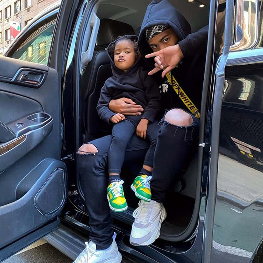 Prettyboyfredo With Daughter In Car Wallpaper