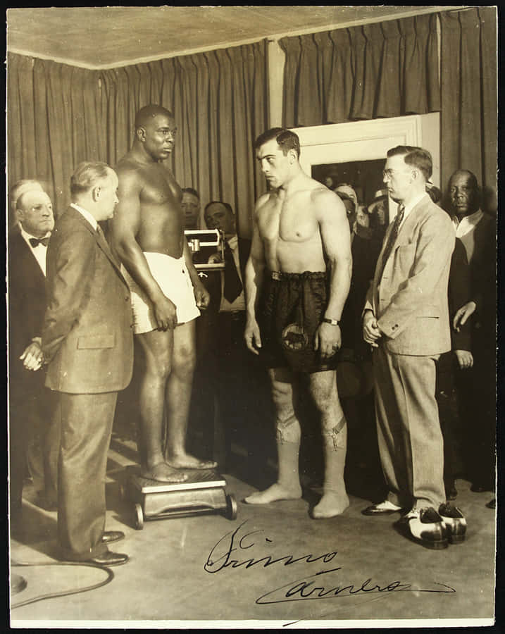 Primo Carnera During A Pre-fight Weigh-in Wallpaper