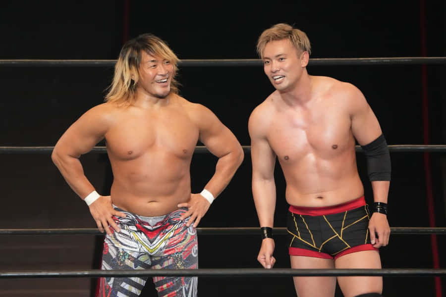 Pro Wrestlers Smilingin Ring Wallpaper