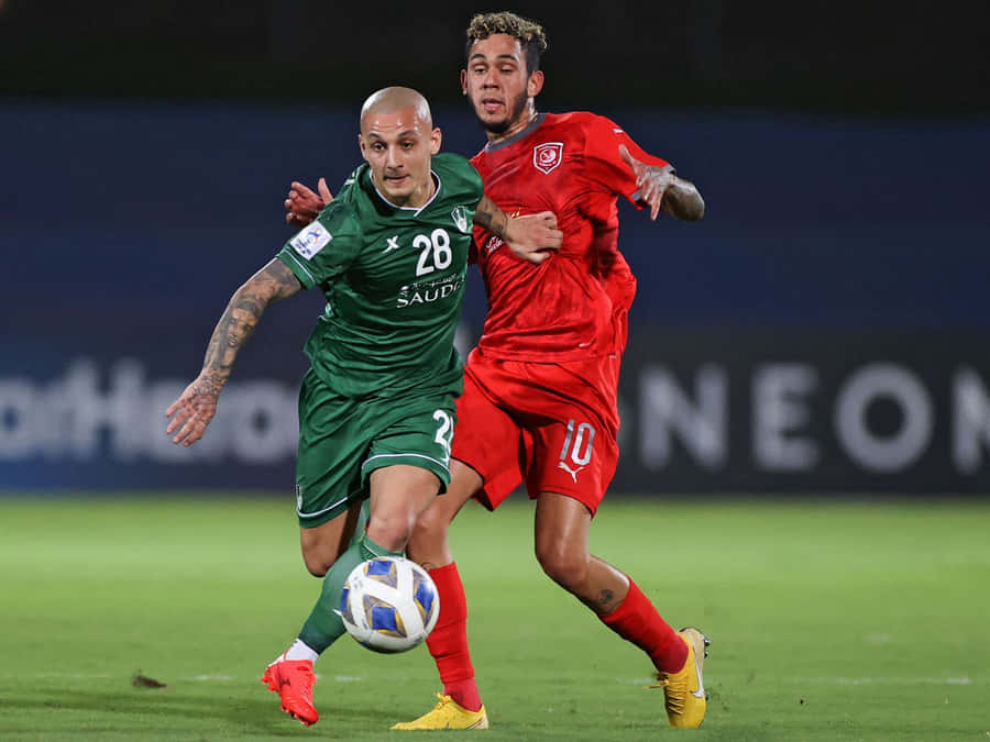 Professional Footballer Alexandru Mitrita In Action For Al Ahli Saudi Football Club Wallpaper