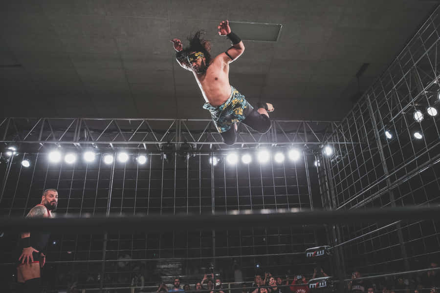 Professional Wrestler Heavyweight Jacob Fatu Frog Splash Wallpaper