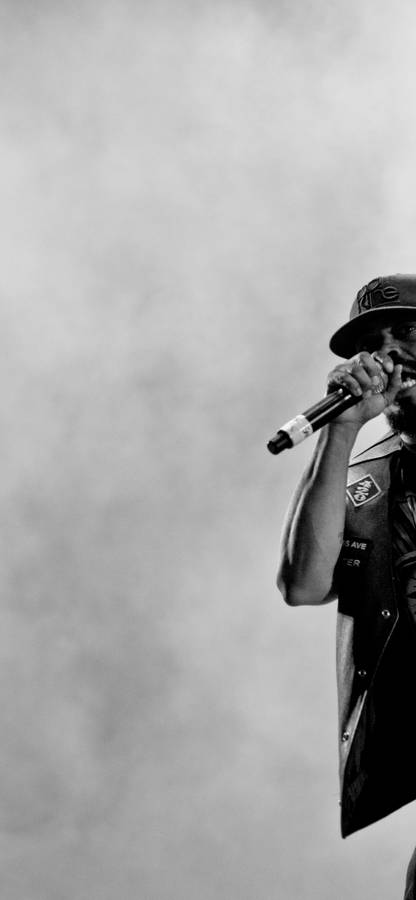 Rapper_ Performing_on_ Stage.jpg Wallpaper