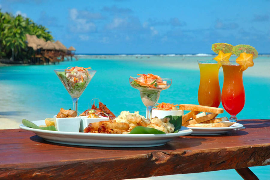 Refreshing Tropical Lunch With Fruity Drinks Wallpaper