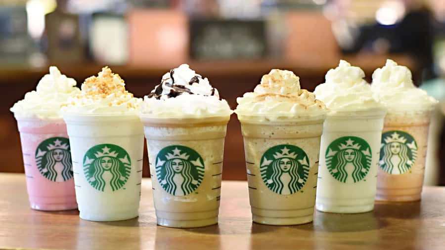 Relax And Rejuvenate While Enjoying A Cappuccino At Aesthetic Starbucks. Wallpaper