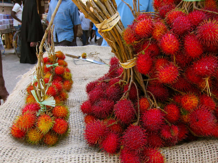 Ripe And Red Pulasan Fruits Wallpaper