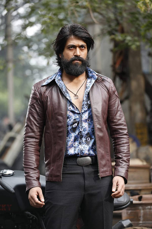 Rocking Star Yash Exuding Style In Brown Leather Jacket Wallpaper