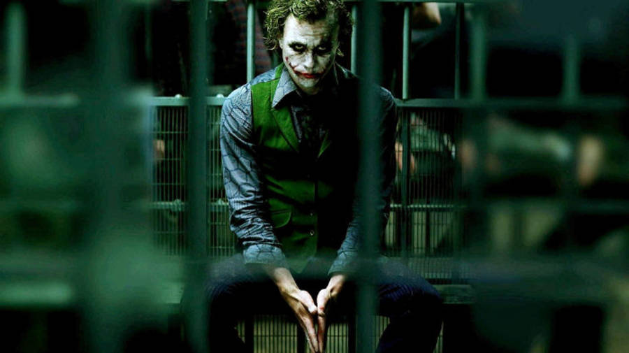 Sad Joker Behind Bars Wallpaper