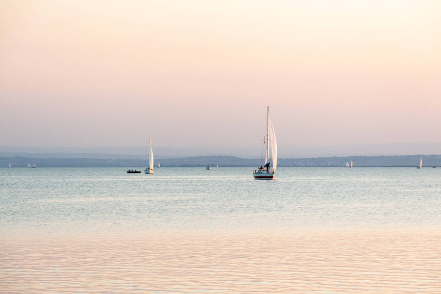 Sailboats On Austria Beach Wallpaper