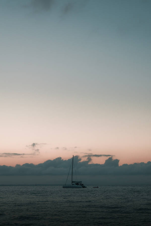 Sailing Under Pastel Twilight Wallpaper