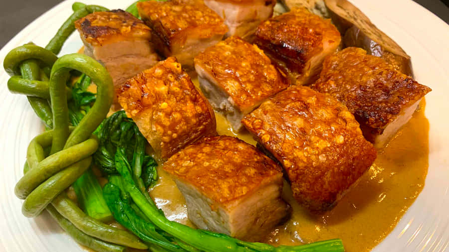 Savor Authentic Filipino Cuisine - Crunchy Deep-fried Pork Belly In Rich Kare-kare Sauce. Wallpaper