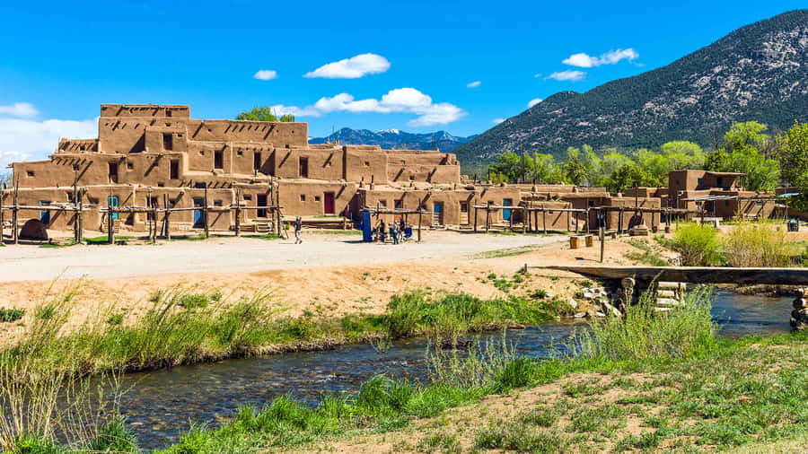 Scenic View Of Rio Pueblo Flowing Through The Ancient Taos Pueblo. Wallpaper
