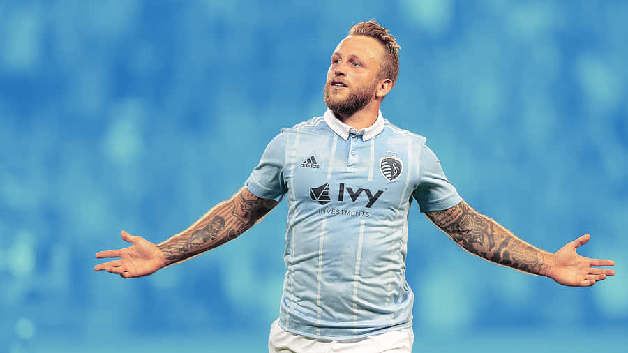 Scottish Professional Football Player Johnny Russell Blue Jersey Wallpaper