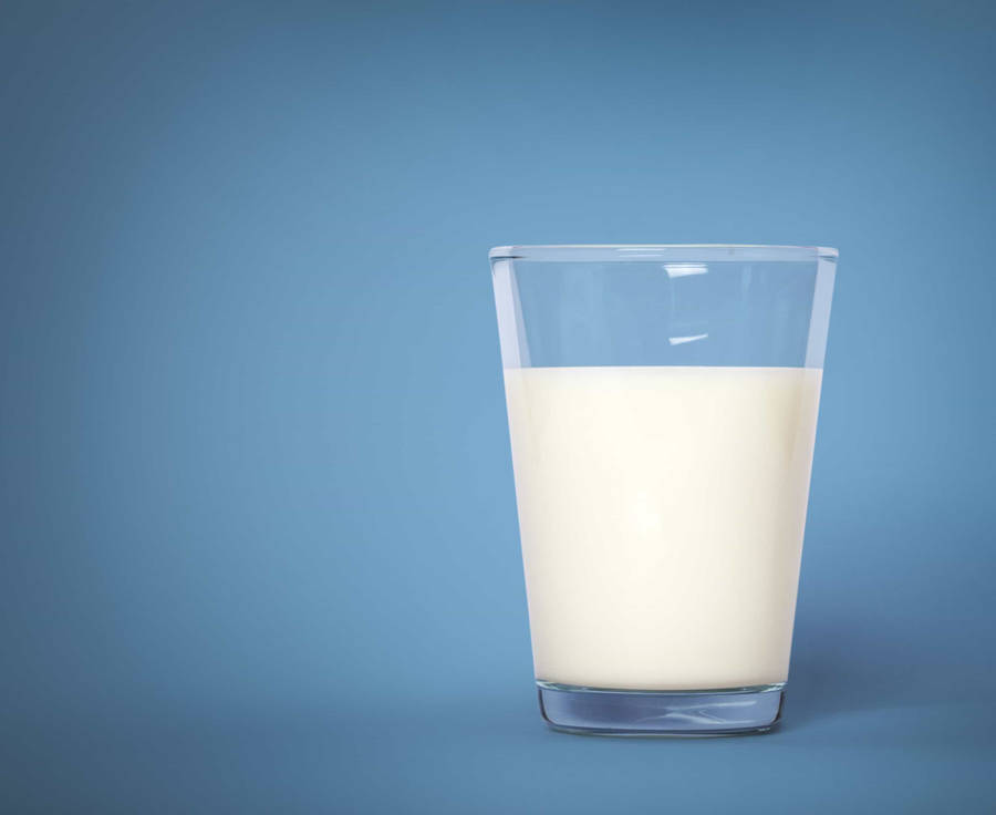 Shiny Glass Of Milk Pale Blue Background Wallpaper