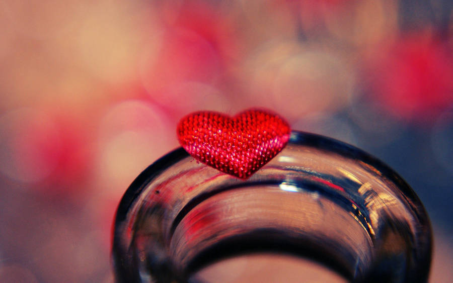 Show Your Love With This Tiny Red Heart. Wallpaper