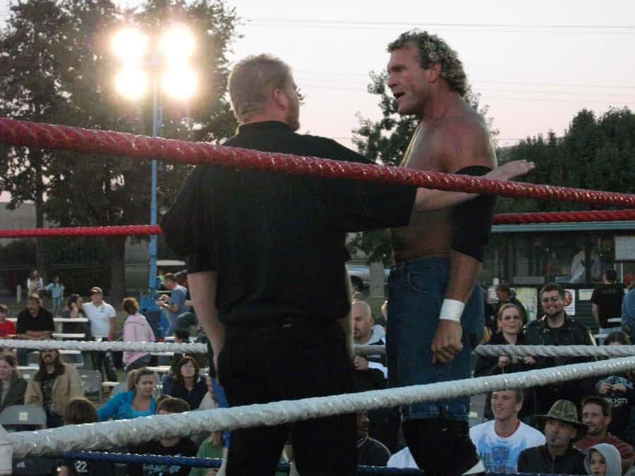 Sid Vicious Wrestling In The Ring With A Referee Wallpaper