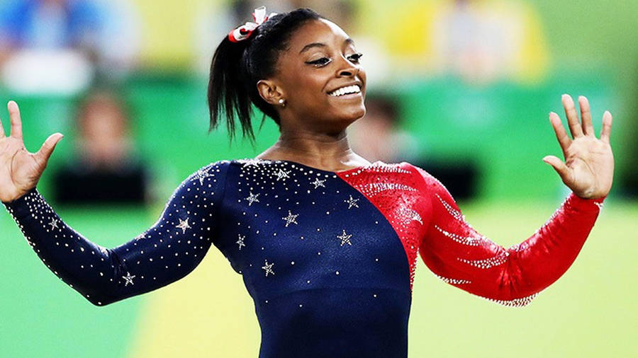 Simone Biles Blue And Red Costume Wallpaper