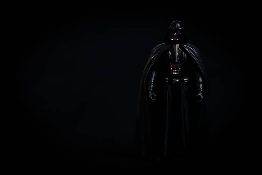 Sith Lord Darth Vader Looms In The Darkness Wallpaper