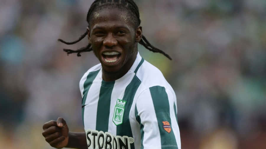 Soccer Player Celebrating On Field Wallpaper