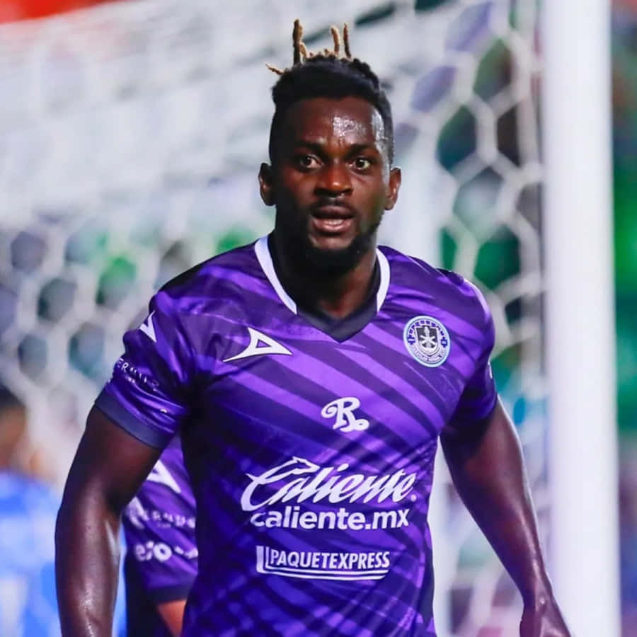 Soccer_ Player_in_ Purple_ Kit Wallpaper