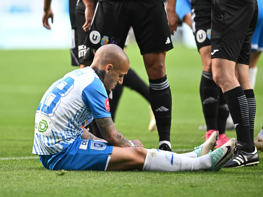 Soccer Player Injury Moment Wallpaper