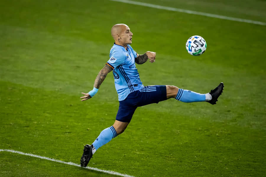 Soccer Player Mid Air Kick Wallpaper