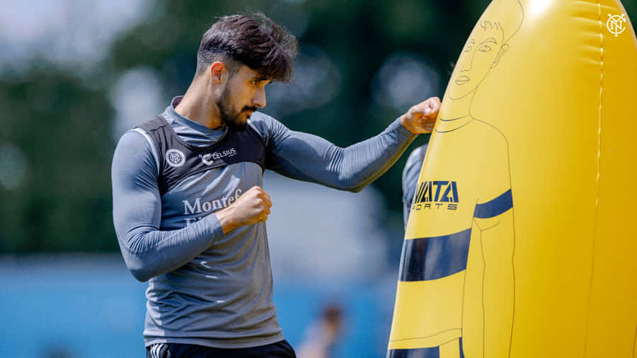 Soccer Player Training With Dummy Wallpaper