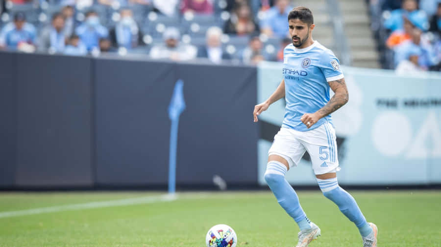 Soccer Playerin Action During Match Wallpaper