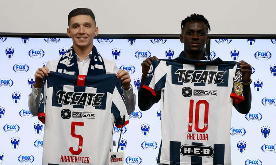 Soccer Players Presenting Jerseys Wallpaper