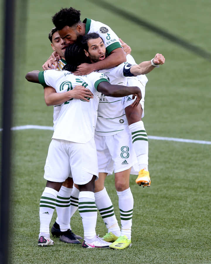 Soccer Team Celebration Huddle Wallpaper