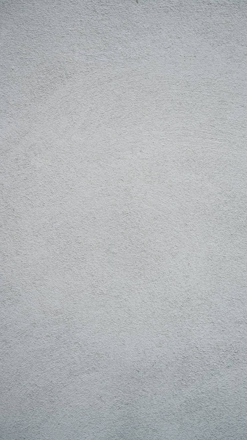 Solid Grey Wall With Subtle Speckles Wallpaper