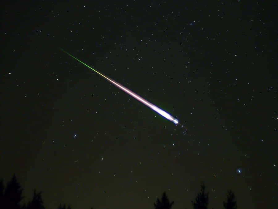 Spectacular Meteor Shower In Night Sky Wallpaper