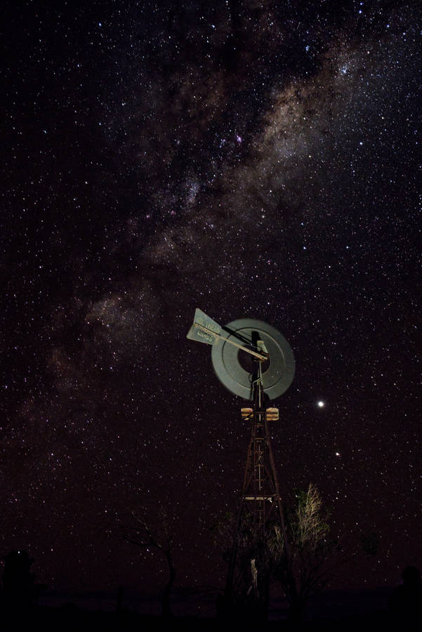 Starry Night Over A Tech Tower Wallpaper