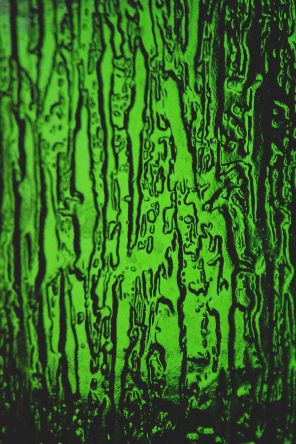 Stay Connected With A Smartphone In A Stylish Green Wallpaper