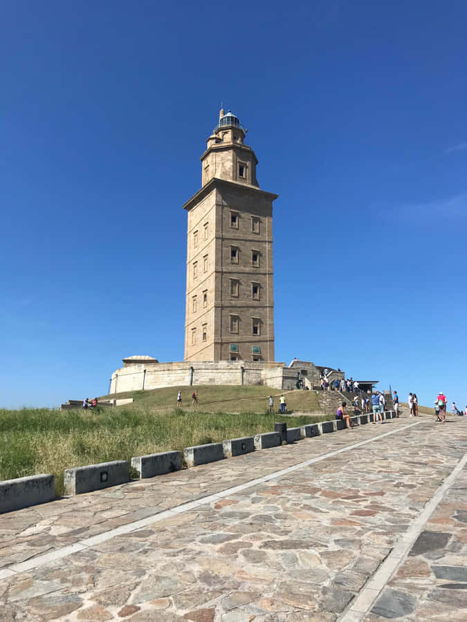 Stone Pathway Along The Tower Of Hercules Phone Wallpaper
