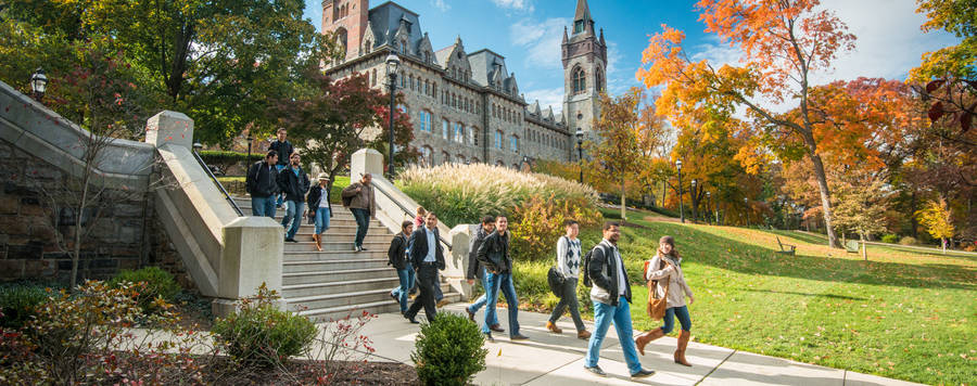 Students Socializing By Lehigh University Center Tower Wallpaper