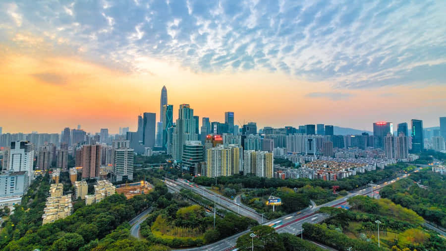 Stunning Purple Sunset Over A Tranquil Ocean Wallpaper