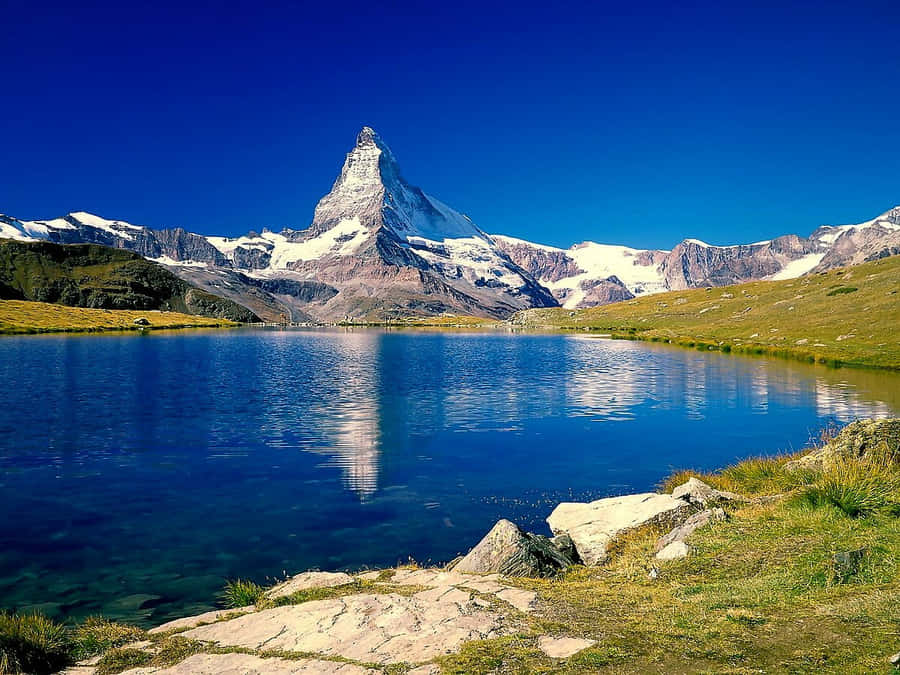 Stunning View Of Matterhorn And Stellisee Lake Wallpaper