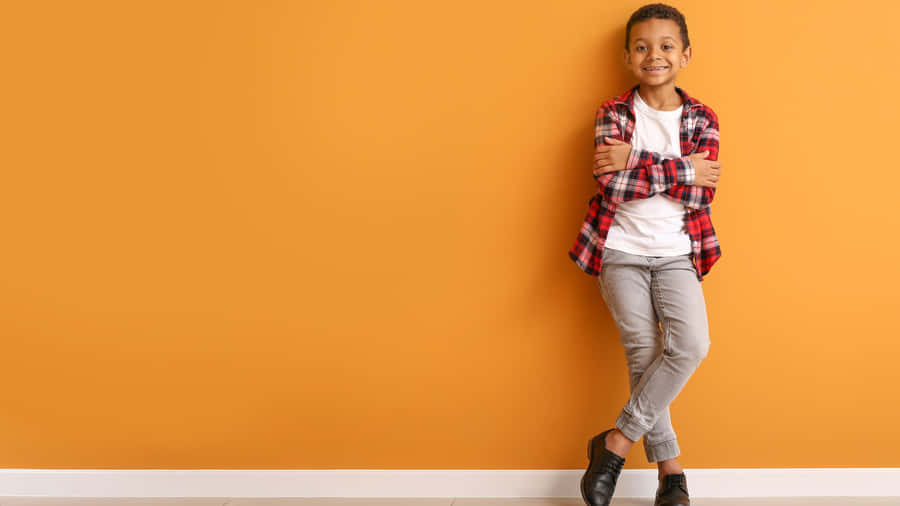 Stylish Boy On Orange Background Wallpaper