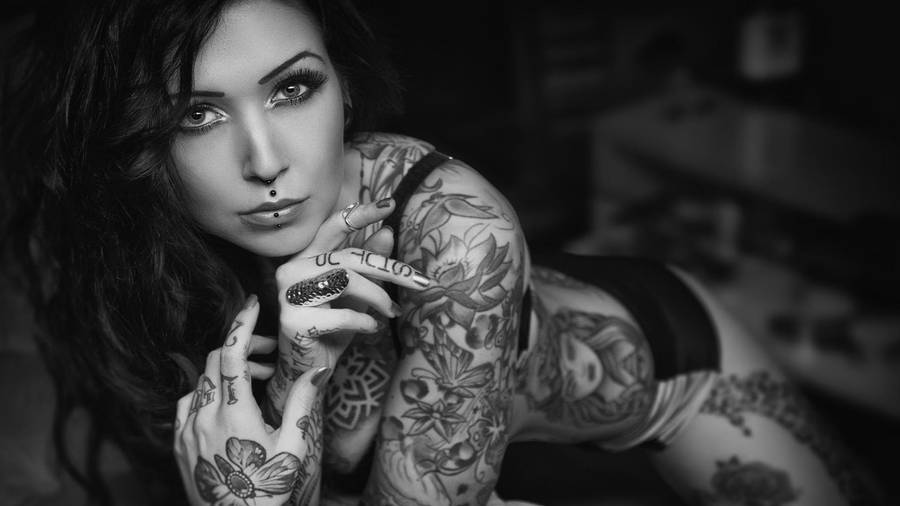 Sultry Woman With Tattoo Wallpaper